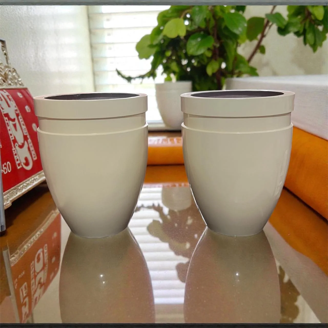 Two glossy white planters